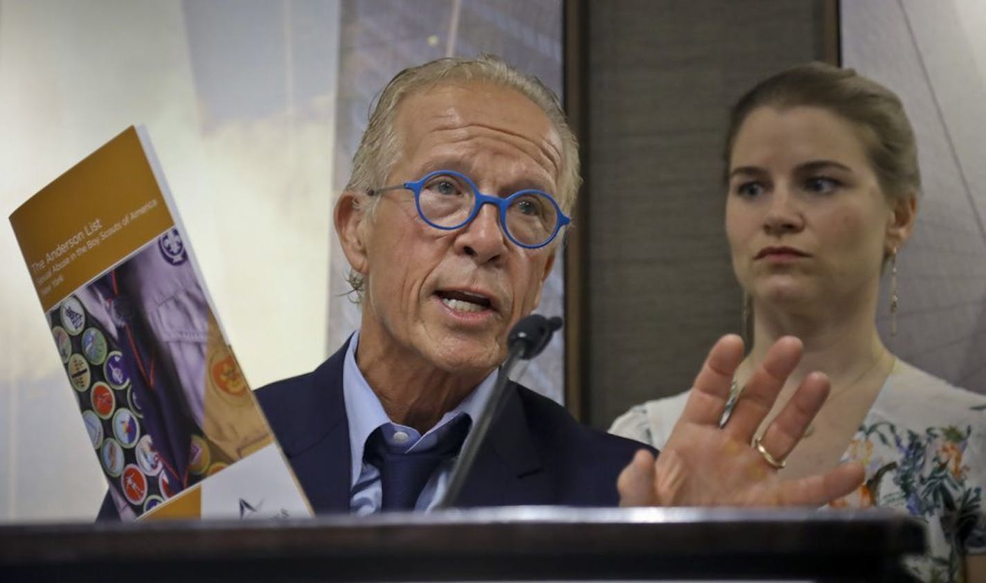 Attorney Jeff Anderson, left, survivor and advocate Birdie Farrell, right, hold a press conference to release the names of more than 130 Boy Scout leaders who worked in New York and were named in Boy Scouts of America (BSA) "Perversion Files" as having allegations of sexually abusing minors, Tuesday April 23, 2019, in New York.