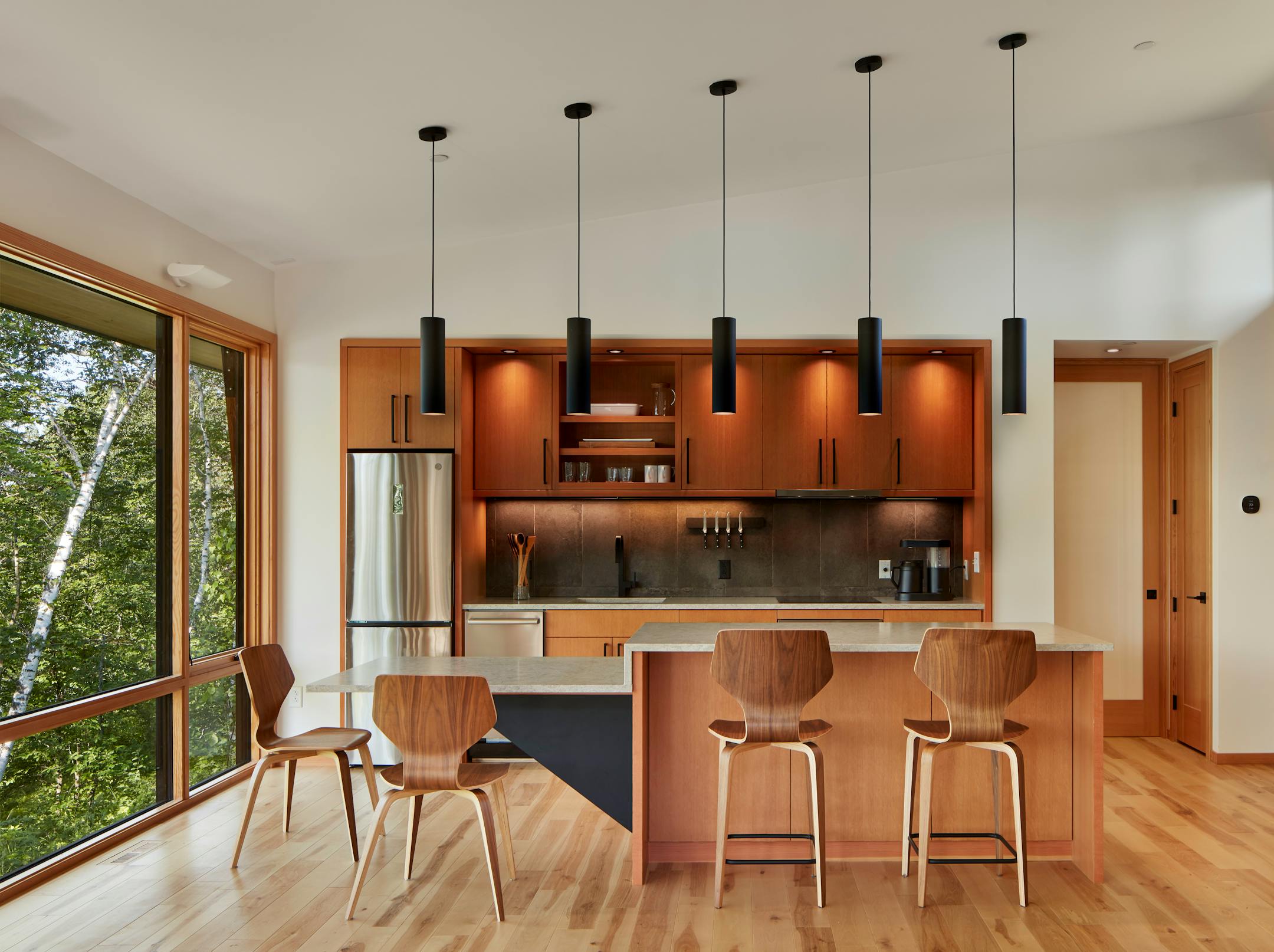 Set against a backdrop of rolling hills and prairie, SALA Architect's Home of the Month winning retreat is an restorative getaway in Frederic, Wis. that also restores the land.