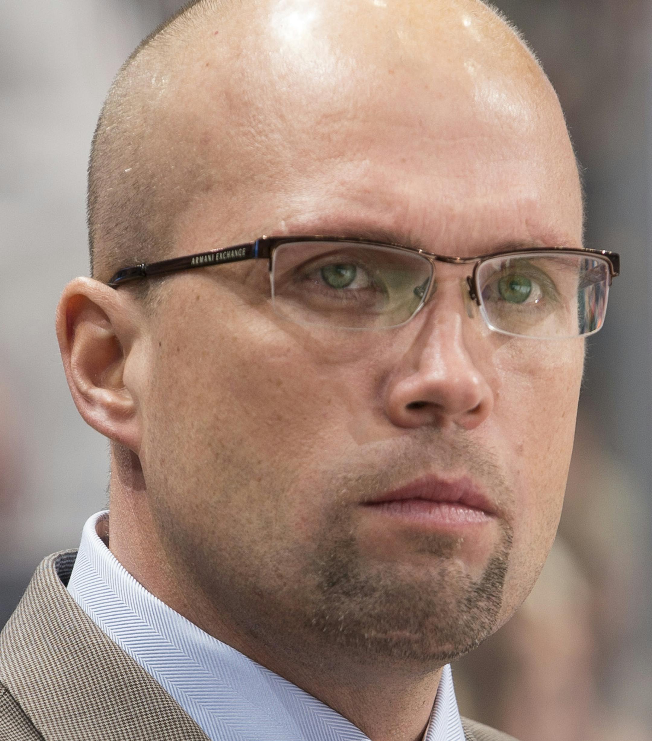 Minnesota Wild head coach Mike Yeo looks on during a break in first period action Tuesday night against the San Jose Sharks. ] (Aaron Lavinsky | StarTribune) The Minnesota Wild take on the San Jose Sharks Tuesday, Jan. 6, 2014 at Xcel Energy Center in St. Paul. ORG XMIT: MIN1501071703510540