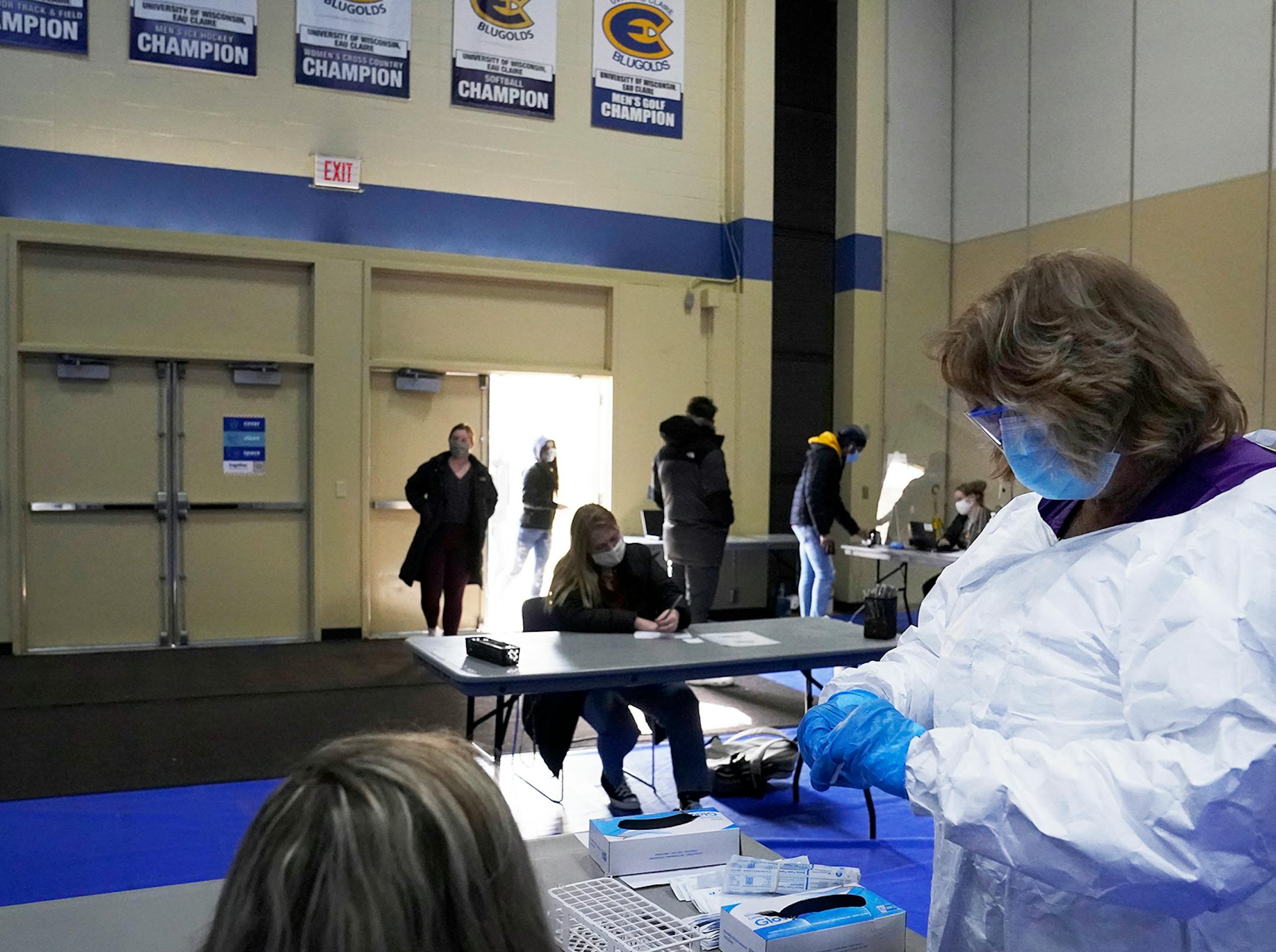 Andrea LeMaster, University of Wisconsin Eau Claire head nurse, prepares a nasal swab antigen test Monday at UW-Eau Claire in Eau Claire, WI.