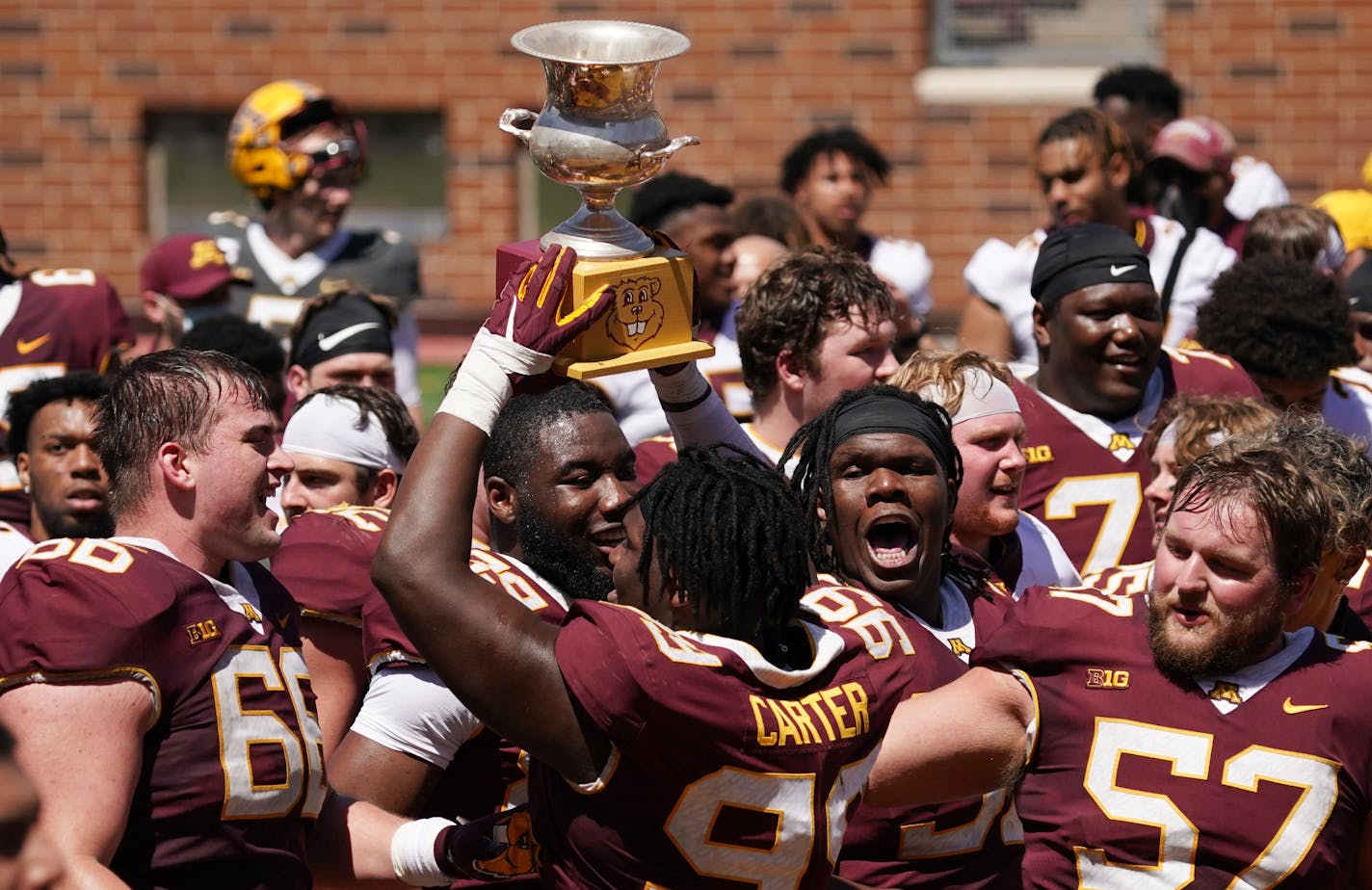 Minnesota Golden Gophers Maroon Team defensive lineman DeAngelo Carter (99) hoisted Goldy's Trophy after beating the Gold Team Saturday. ] ANTHONY SOUFFLE • anthony.souffle@startribune.com