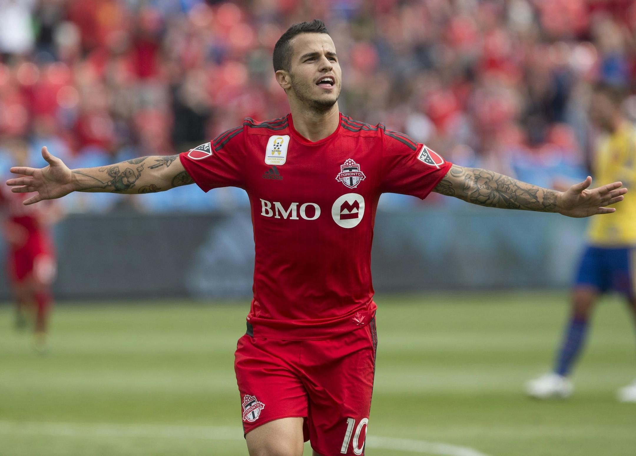 Toronto FC's Sebastian Giovinco celebrates after scoring his team's second goal against Colorado Rapids during the first half of the MLS soccer game in Toronto on Saturday, Sept. 19, 2015. (Chris Young/The Associated Press via AP)