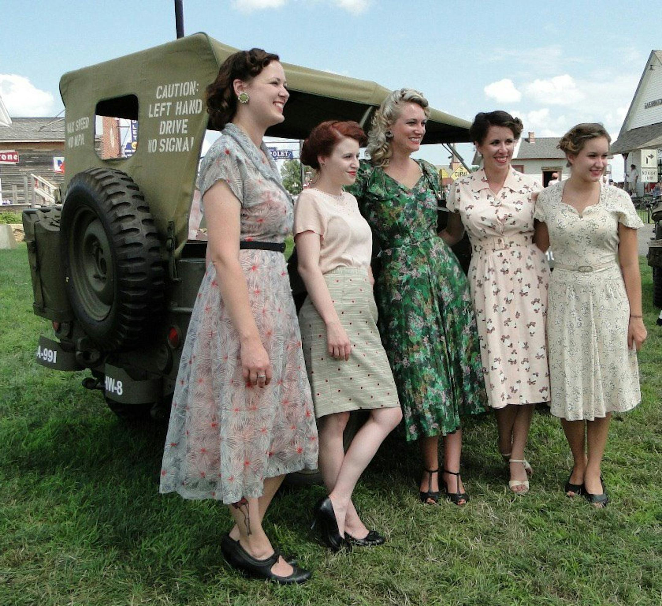 Courtesy Alissa Wirth (left to right) Brigid Monroe, Jessica Musselman (both of Hastings), Alissa Wirth (of Red Wing), Adell Hanson and Audrey Bottolfson (both of Hastings) are members of the Catís Meow WWII Girls, who try to wear as many original 1940s era outfits as possible, relying on reproductions only when it is hard to find items. (Photo submitted)