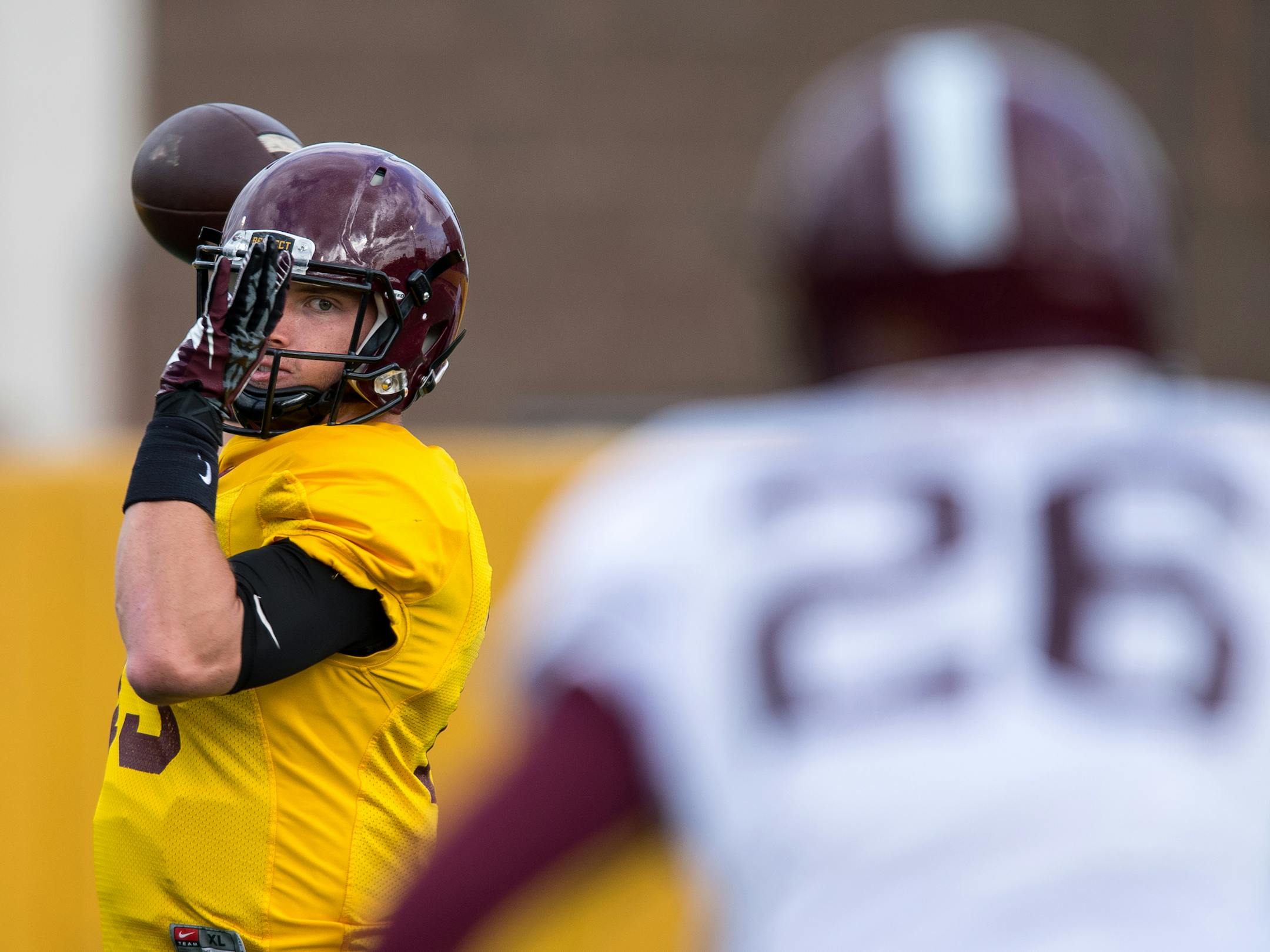 Gophers quarterback Conor Rhoda threw a pass to wide receiver Brian Smith (26) during practice Tuesday afternoon. ] (AARON LAVINSKY/STAR TRIBUNE) aaron.lavinsky@startribune.com The University of Minnesota Golden Gophers football team practiced on Tuesday, Oct. 11, 2016 at Bierman Field in Minneapolis, Minn.