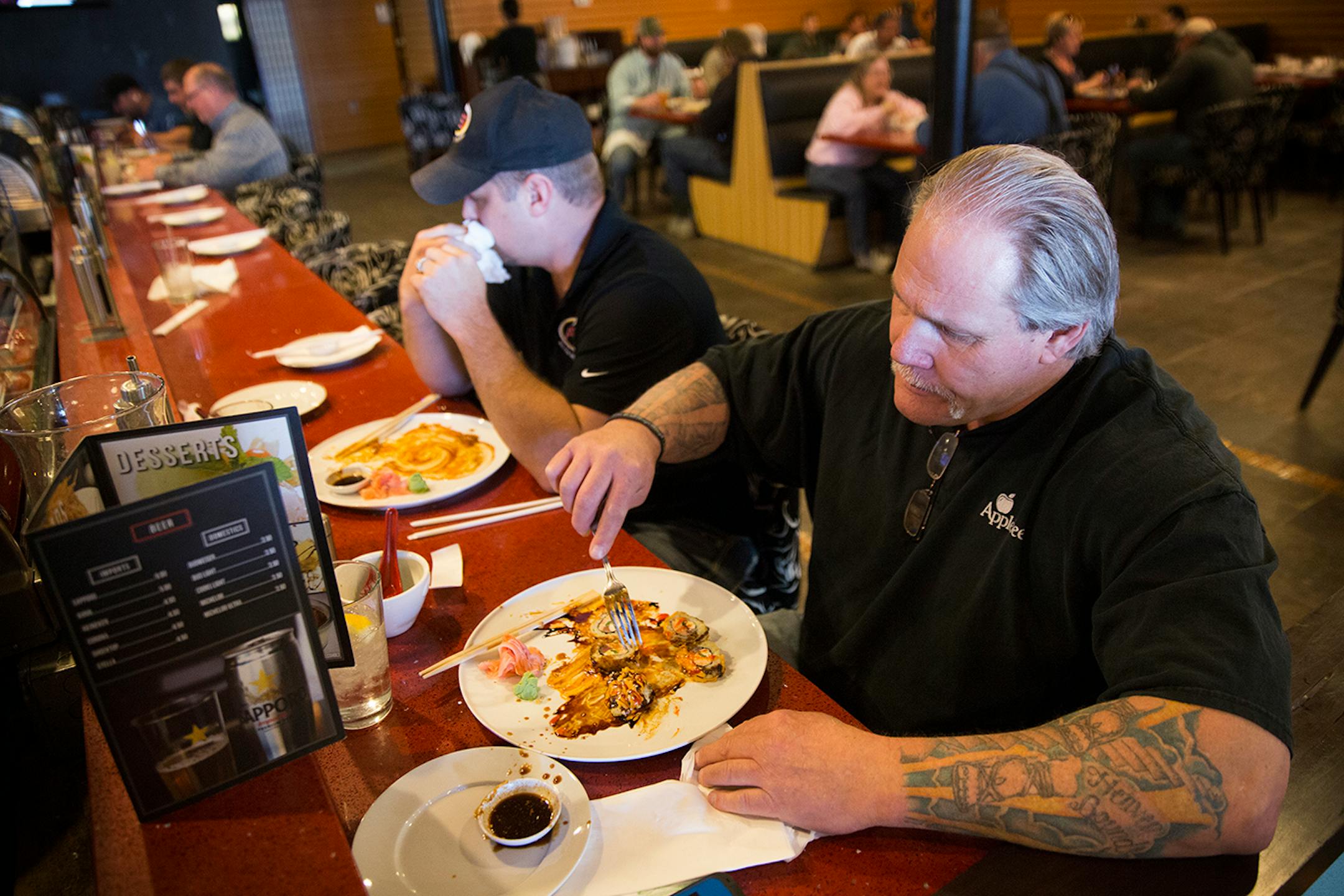 Vernon Stickler eats lunch at Basil Sushi Bar, which has been open for a year and a half in downtown Williston, North Dakota on Tuesday, March 31, 2015. Stickler, who is from Oklahoma, is in the oil field recertification business.