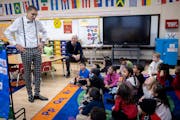 Minneapolis School Board Chair Collin Beachy, left, and Emerson Dual Language School Principal James Clark visited with a kindergarten class in Minnea