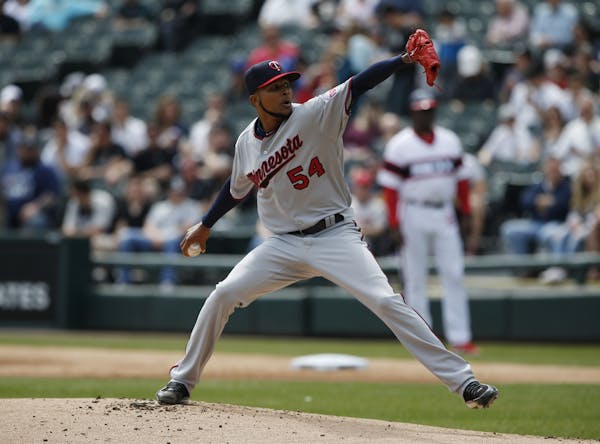 Minnesota Twins starting pitcher Ervin Santana throws against the Chicago White Sox during the first inning of a baseball game Sunday, April 9, 2017, 