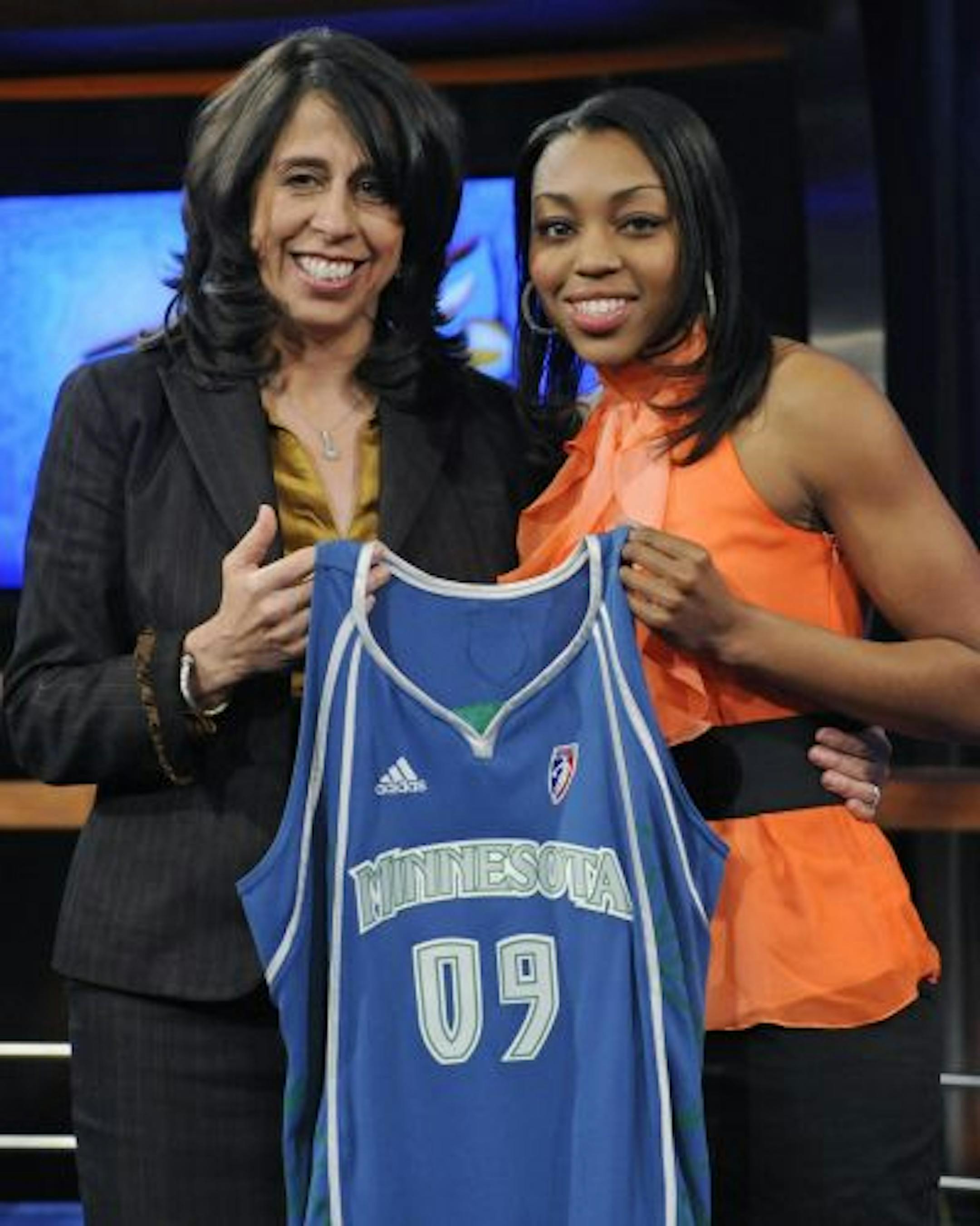 Connecticut's Renee Montgomery, right, holds up a Minnesota Lynx jersey as she poses with WNBA president Donna Orender after Montgomery was chosen as the number four pick in the WNBA draft by the Lynx on Thursday, April 9, 2009, in Secaucus, N.J.