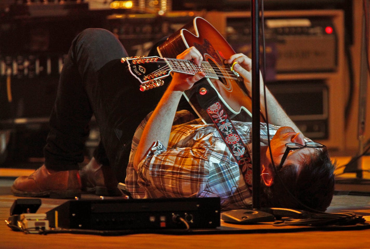 MARLIN LEVISON*mlevison@startribune.com GENERAL INFORMATION Portland folk-rock band Decemberists in concert at State Theatre in downtown Minneapolis IN THIS PHOTO: ] Decemberists frontman Colin Meloy on guitar and harmonica. Decemberist band members performed. Meloy lay on the stage floor to play in an opening number.