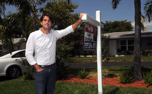Bruno Duarte stands in front of a house he is flipping in Oakland Park, Florida, on May 9, 2013. Flippers often improve the homes they purchase, boost