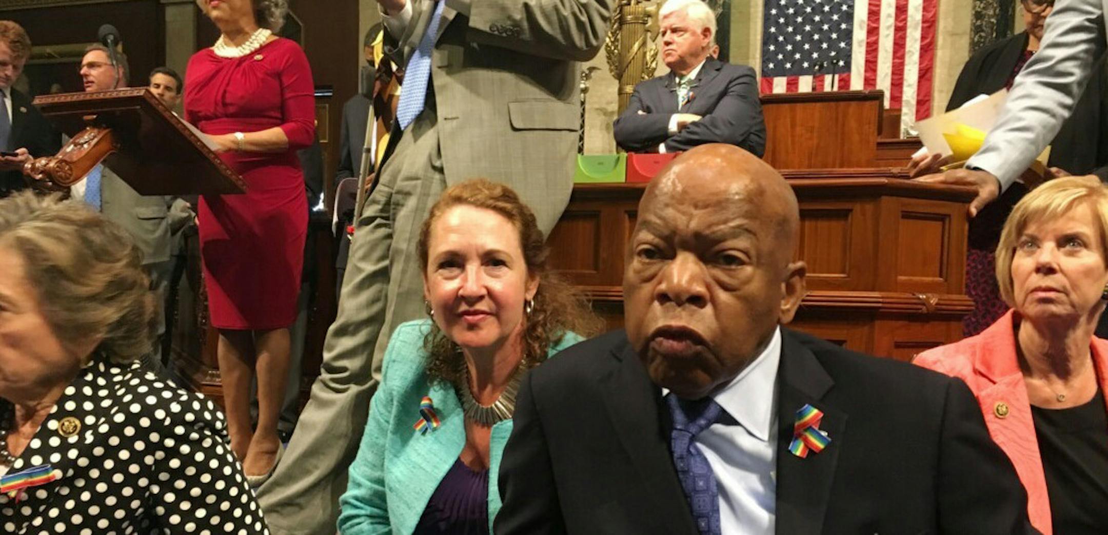 This photo provided by Rep. Chillie Pingree,D-Maine, shows Democrat members of Congress, including Rep. John Lewis, D-Ga., center, and Rep. Elizabeth Esty, D-Conn. as they participate in sit-down protest seeking a a vote on gun control measures, Wednesday, June 22, 2016, on the floor of the House on Capitol Hill in Washington. (Rep. Chillie Pingree via AP) ORG XMIT: MIN2016062213553835