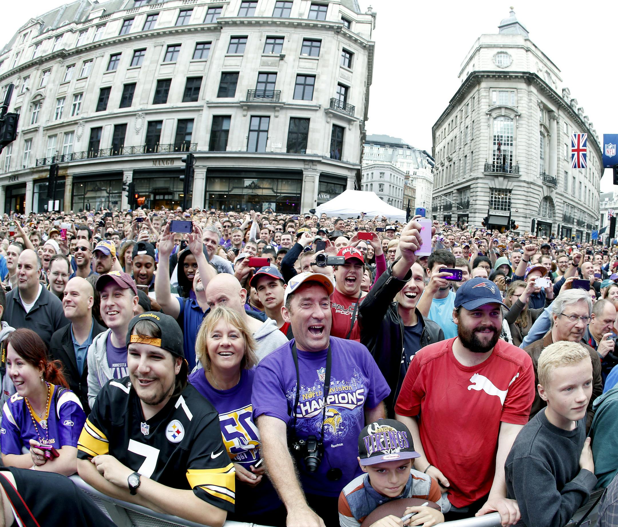 Fans and spectators filled Regent Street in London as members of the Minnesota Vikings took the stage during an NFL Block Party on Saturday. ] CARLOS GONZALEZ cgonzalez@startribune.com September 28, 2013, London, England (Minnesota Vikings in London) Regent Street in London is closed to traffic from Oxford Circus to Piccadilly Circus as the NFL stages its first Block Party, featuring interactive NFL content, team zones, music and entertainment, cheerleader performances, food and drink, merchandi
