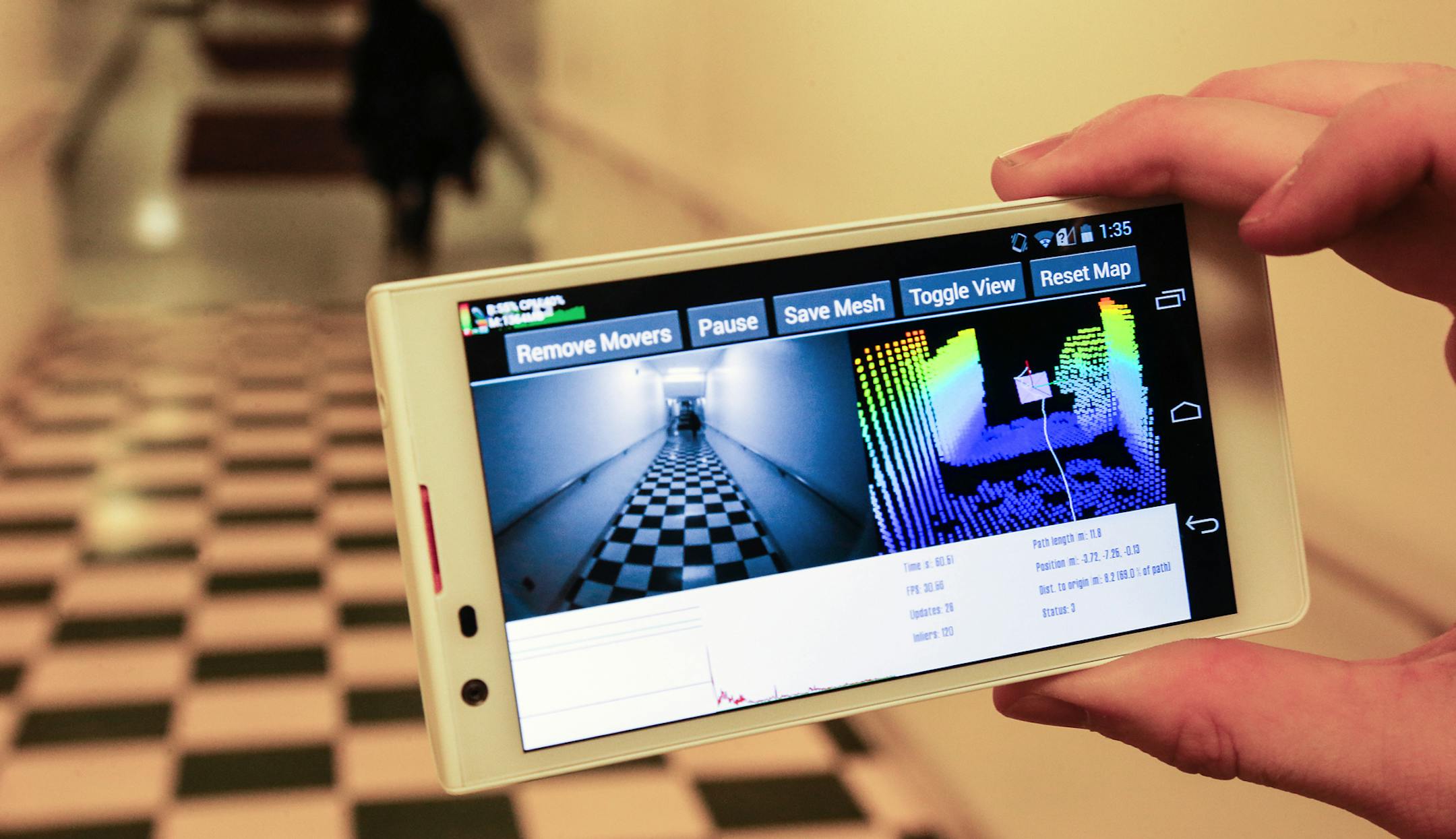 A cell phone with the 3D program running displayed a hallway in a U of M building. ] Stergios Roumeliotis, a U of M computer science professor, is working on a project for Google to develop 3D camera images and display them on a cell phone. It would allow the camera to show the user a room exactly the way his eye would see it. (MARLIN LEVISON/STARTRIBUNE(mlevison@startribune.com)