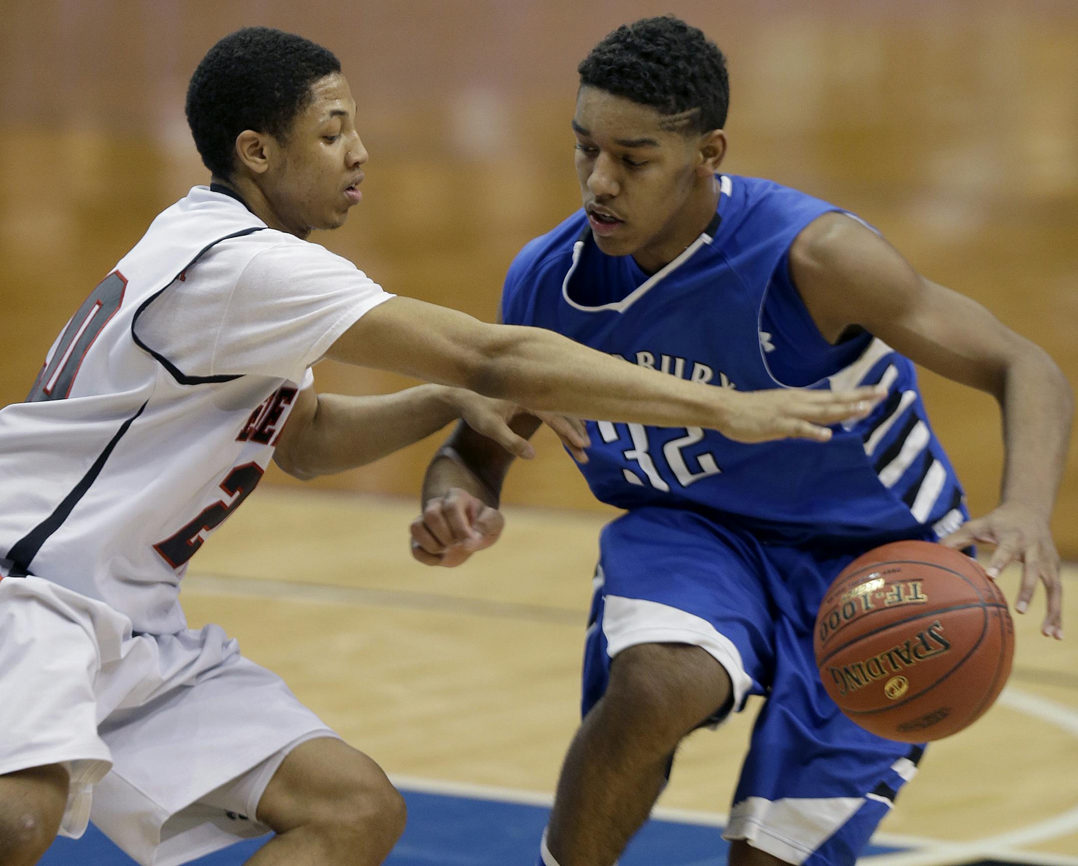 Eden Prairie's Andre Wallace and Woodbury's Diallo Powell's battled for the ball during the second half of the boys' basketball quarterfinals at the Target Center, Wednesday, March 20, 2013 in Minneapolis, MN. Eden Prairie defeated Woodbury 70-59. (ELIZABETH FLORES/STAR TRIBUNE) ELIZABETH FLORES • eflores@startribune.com