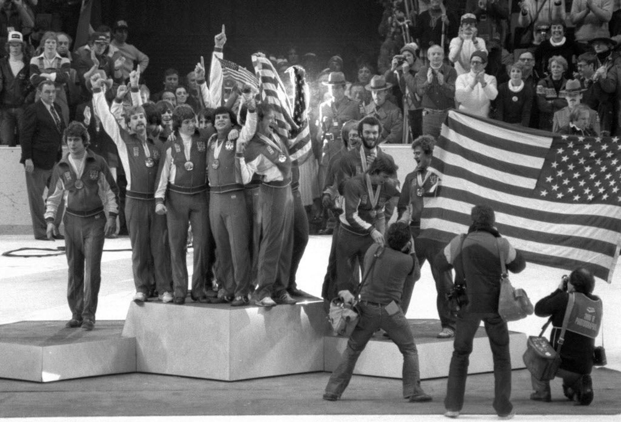 Lake Placid, New York, February 1980 - The USA hockey team receives gold medals after their Miracle on Ice triumph over the Soviets and then Finland.