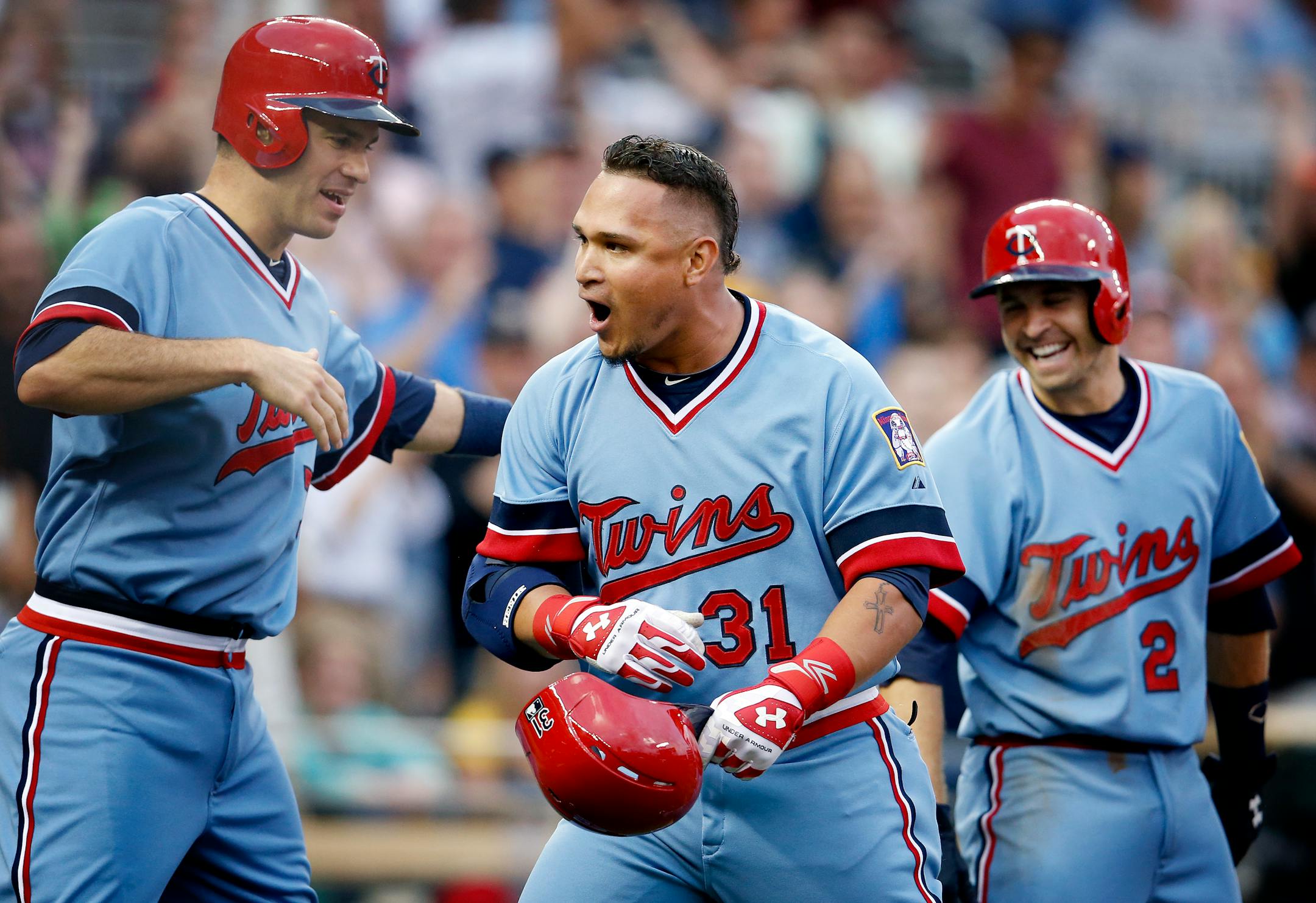 Oswaldo Arcia (31) celebrated with Joe Mauer (7) and Brian Dozier (2) after hitting a grand slam homerun in the third inning. ] CARLOS GONZALEZ cgonzalez@startribune.com - June 5, 2014, Minneapolis, Minn., Target Field, MLB, Minnesota Twins vs. Milwaukee