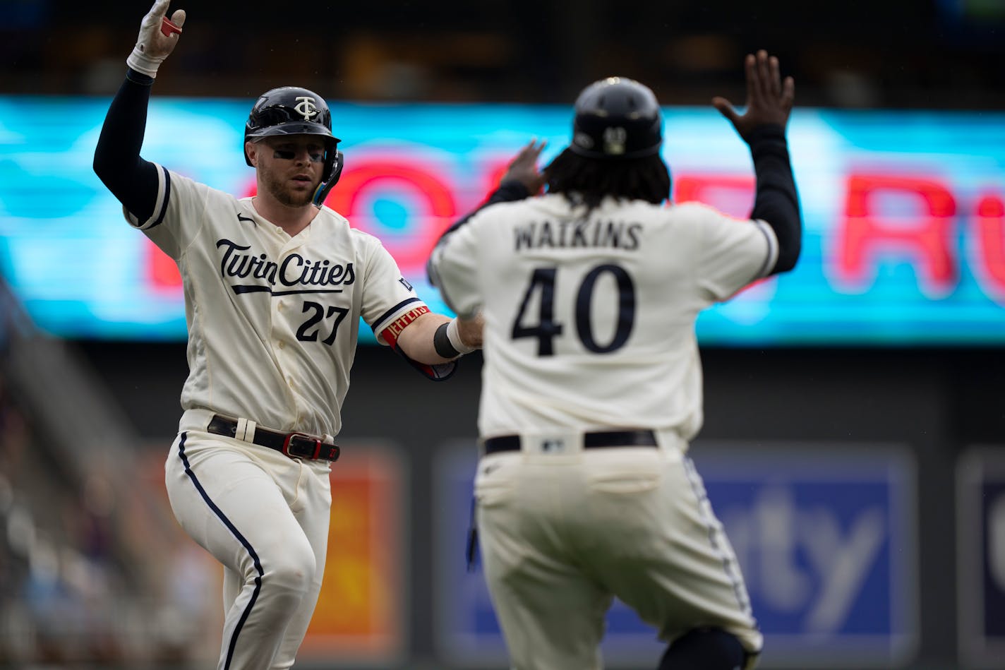 Minnesota Twins catcher Ryan Jeffers (27) celebrates with Minnesota Twins third base coach/outfield coach Tommy Watkins (40) after hitting a two-run home run in the seventh inning. The Minnesota Twins hosted the Los Angeles Angels at Target Field on Sunday, Sept. 24, 2023 in Minneapolis, Minn. ] RENEE JONES SCHNEIDER • renee.jones@startribune.com