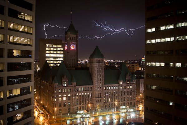 Lightning illuminates the sky over downtown Minneapolis on Wednesday, April 1, 2015. ] (Aaron Lavinsky | StarTribune)