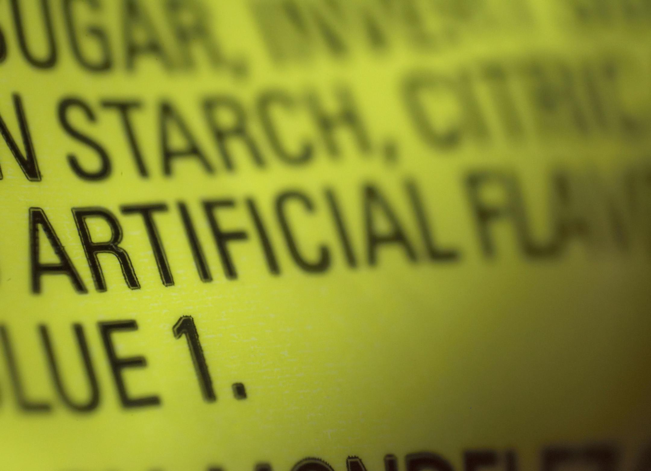 This Thursday, Nov. 8, 2018 photo shows part of an ingredient label, which lists "artificial flavoring," on a packet of candy in New York. In November 2018, the U.S. Food and Drug Administration has decided to give companies two years to purge their products of the six ingredients, described only as “artificial flavors” on packages. The words “artificial flavor” or “natural flavor” refer to any of thousands of ingredients. (AP Photo/Patrick Sison)