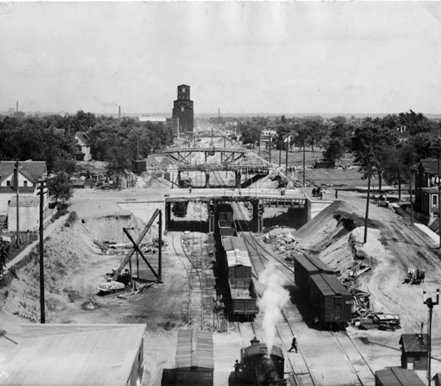 Looking west from Fourth Avenue South at the bridges built over the railroad tracks in Minneapolis in what is now the Midtown Greenway. Photo from 1915, courtesy of the Minnesota Historical Society. ORG XMIT: Documentation