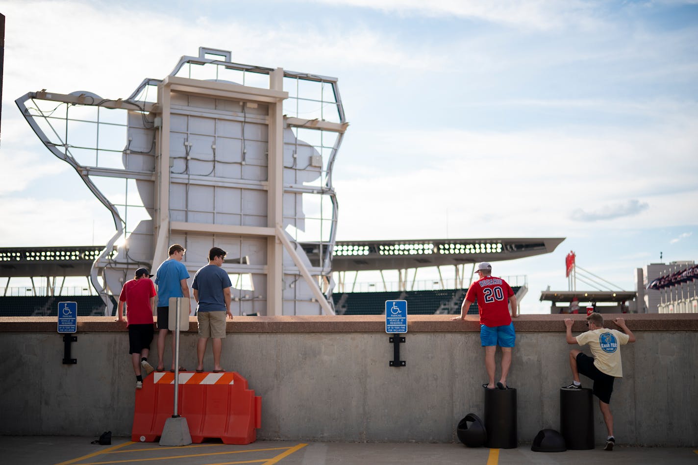 Fans were resourceful finding things to stand on to see over the wall on the top floor of a parking ramp across from Target Field recently to watch the Twins and Cardinals.