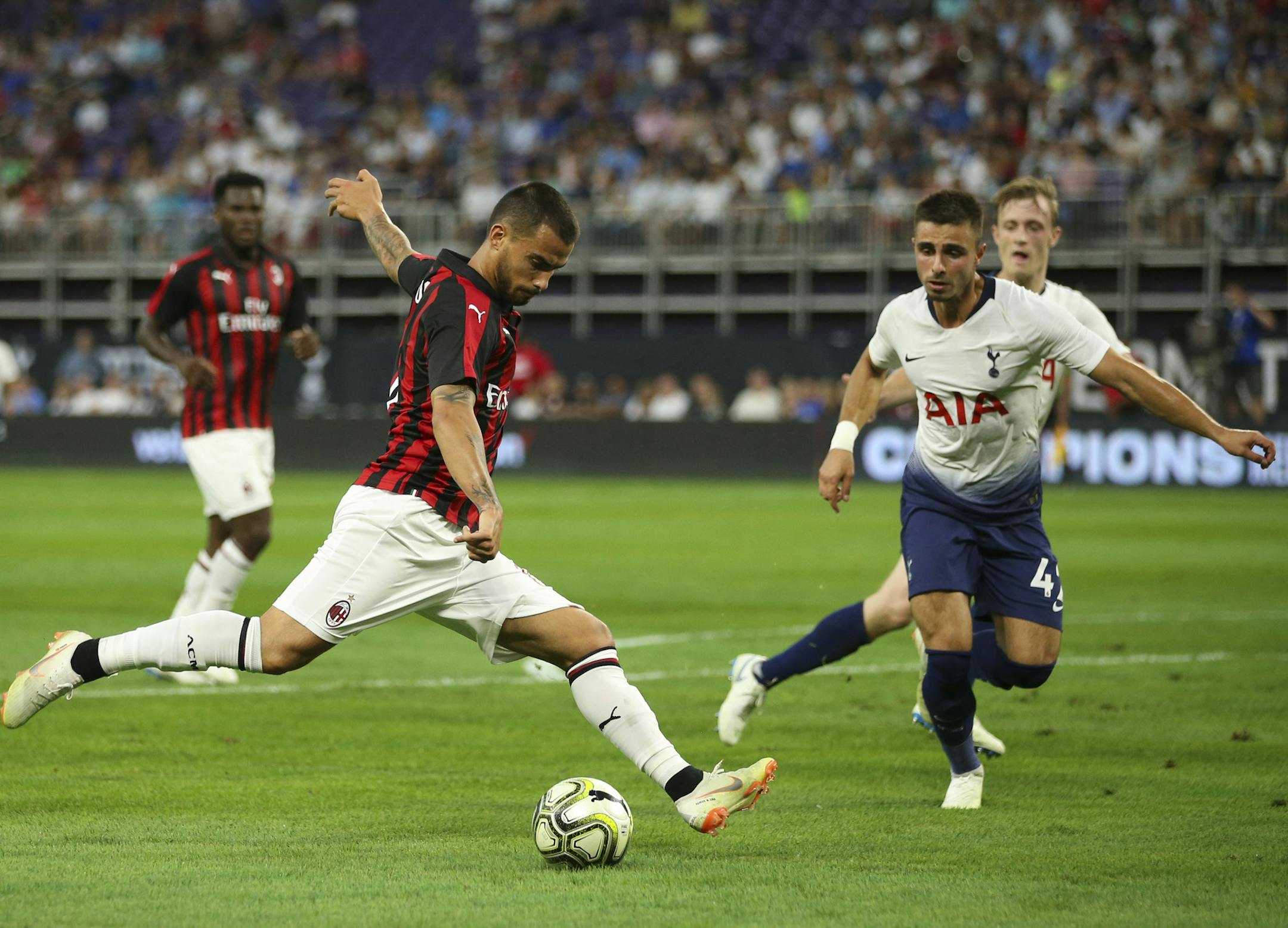 AC Milan forward Suso (8) took a first half shot on goal while Tottenham Hotspur defender Anthony Georgiou (42) closed in. ] JEFF WHEELER ï jeff.wheeler@startribune.com Tottenham Hotspur faced AC Milan in an International Champions Cup series game at U.S. Bank Stadium in Minneapolis Tuesday night, July 31, 2018.