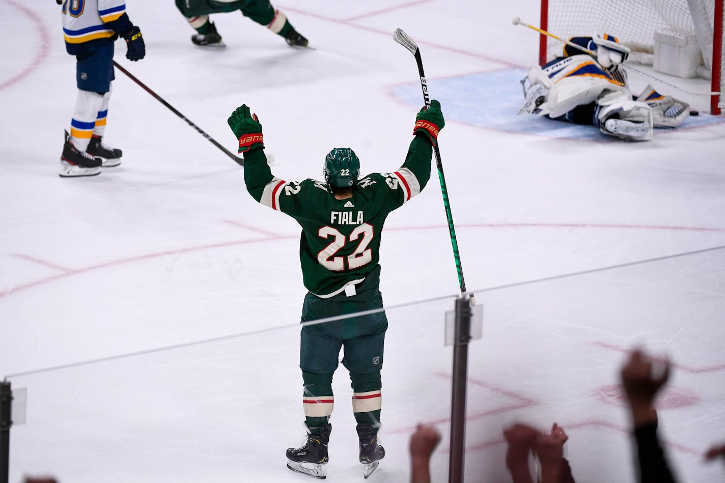 Wild left wing Kevin Fiala celebrates after&nbsp;scoring past St. Louis Blues goalie Jordan Binnington to win in overtime Saturday night.