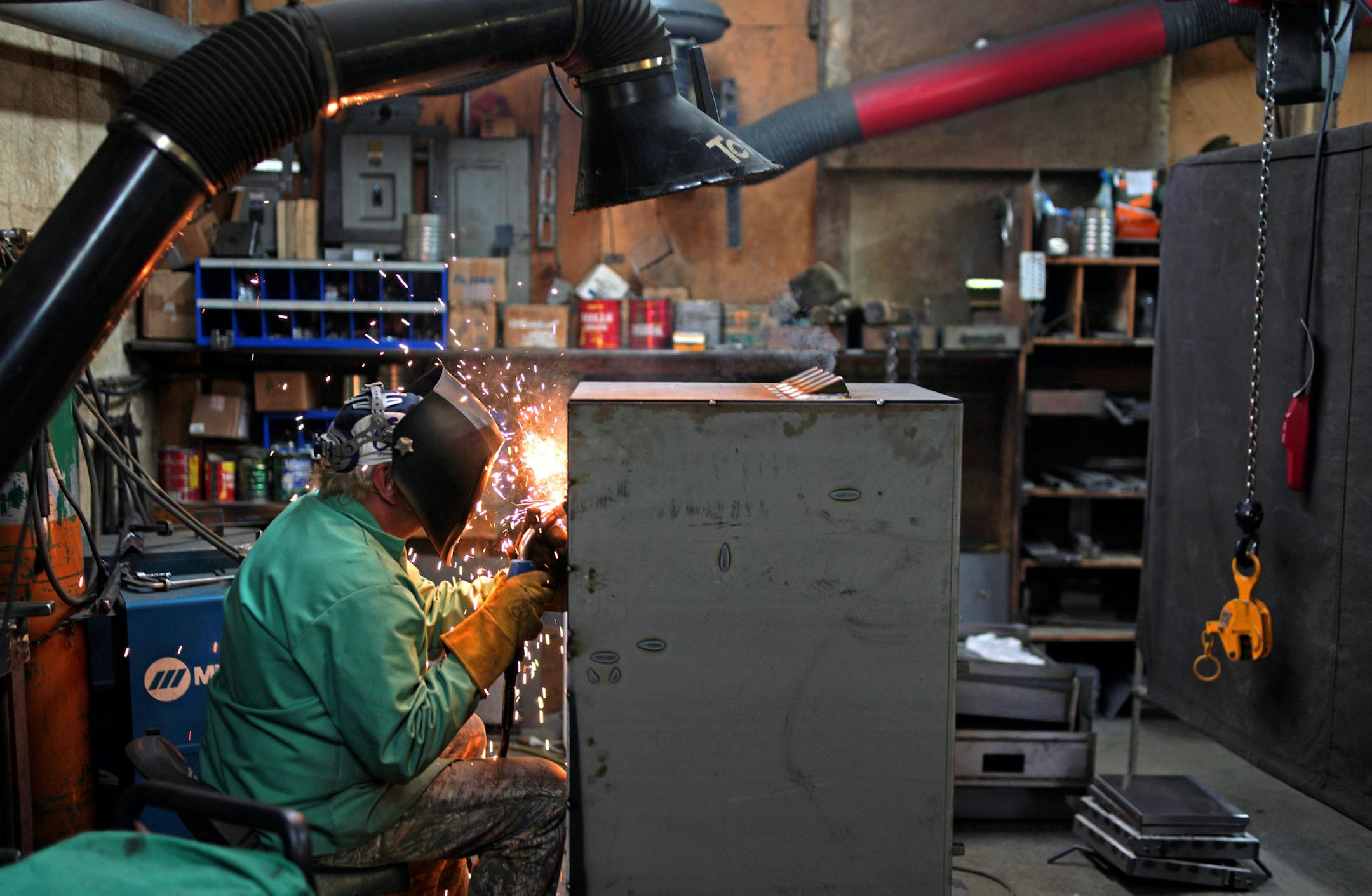 Welder Rick Berens works on a wood burning furnace. ] Lampa Manufacturing plant before the move to their new facility down the street. The Lamppa's have been manufacturing their wood burning stoves and furnaces for 80 years in this small plant in Tower. Despite the simple "old school "production facility, Lamppa is on the cutting edge of wood stove design. Lamppa is the only furnace maker in the nation to date to receive the Ò2020 mandateÓ certification from the Environmental Protectio
