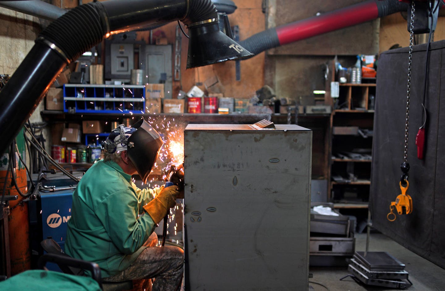 Welder Rick Berens works on a wood burning furnace. ] Lampa Manufacturing plant before the move to their new facility down the street. The Lamppa's have been manufacturing their wood burning stoves and furnaces for 80 years in this small plant in Tower. Despite the simple "old school "production facility, Lamppa is on the cutting edge of wood stove design. Lamppa is the only furnace maker in the nation to date to receive the &#xd2;2020 mandate&#xd3; certification from the Environmental Protectio