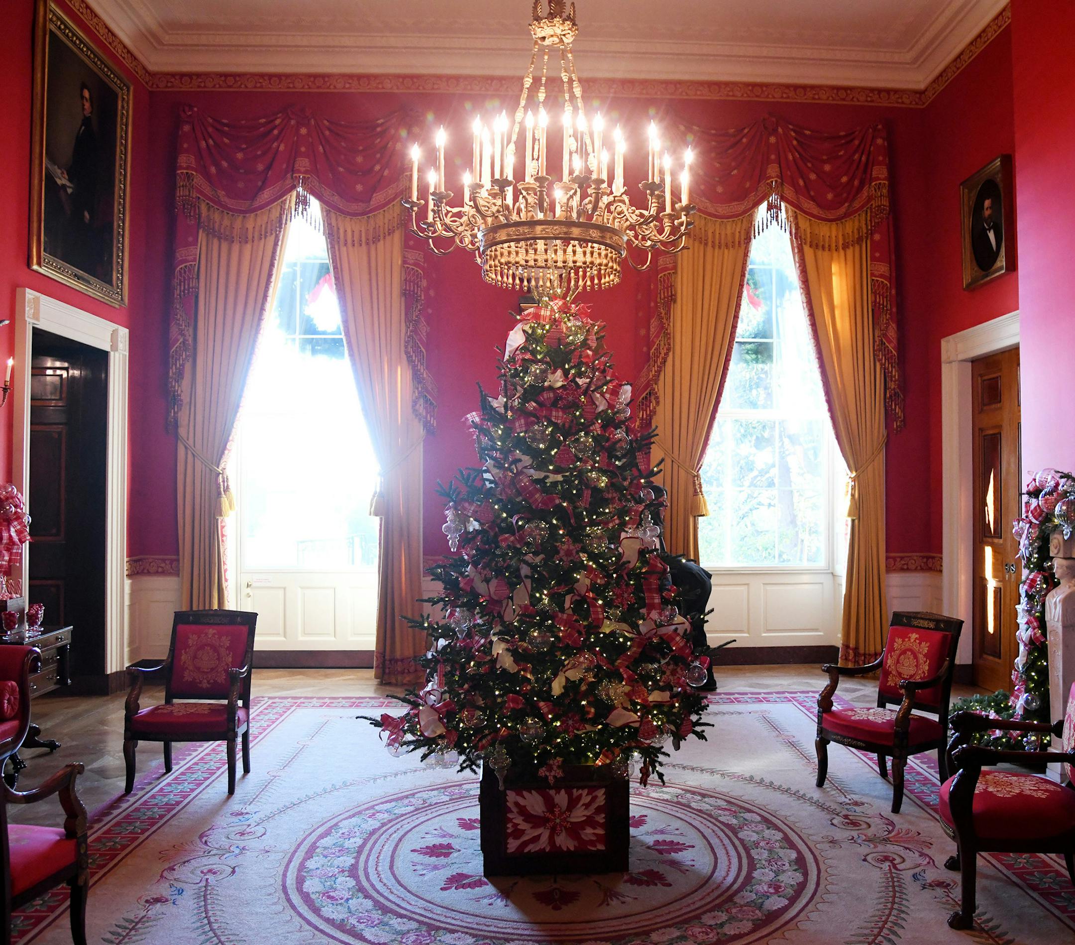 Christmas trees and holiday decorations are seen in the Red Room of the White House in Washington, DC, November 27, 2017.(Olivier Douliery/Abaca Press/TNS) ORG XMIT: 1216950