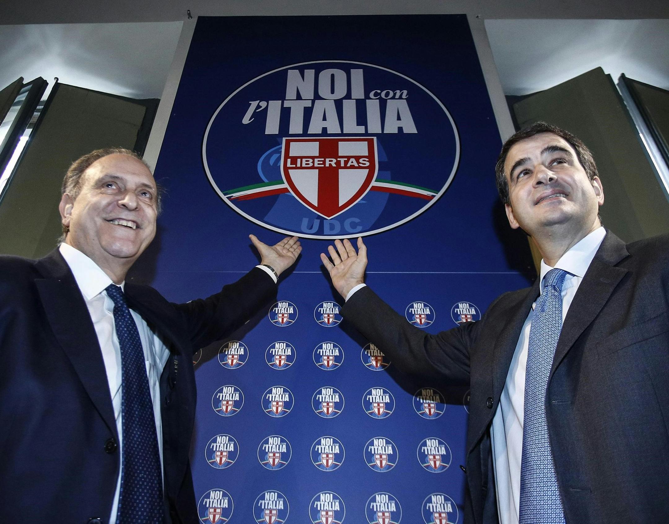 Lorenzo Cesa (L) and Raffaele Fitto during a press conference to present the symbol of ''Noi con l'Italia'' political party, Roma 11 January 2018. They will run at the national election in a coalition with Berlusconi's Forza Italia, the League and the Brothers of Italy (FdI) party. ANSA/GIUSEPPE LAMI (ANSA via AP)