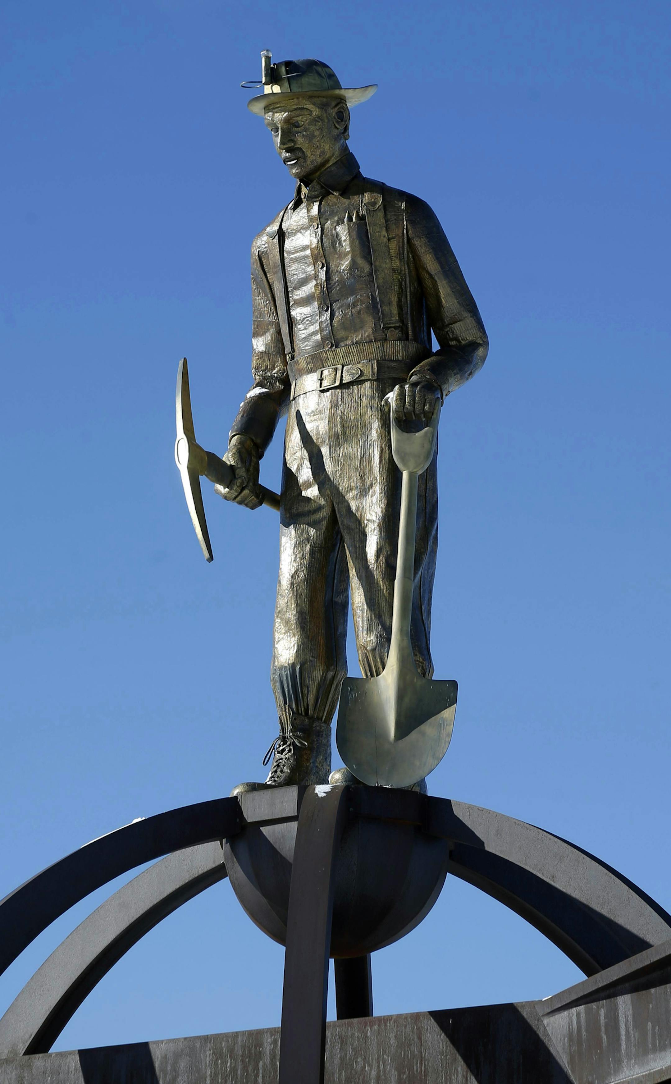 In this photo taken Feb. 9, 2016, the Ironman Memorial stands off the highway leading to Chisholm, Minn. The steel downturn has hit hard on the main streets of northeastern Minnesota&#xed;s Iron Range with three of Minnesota&#xed;s six mines idle, resulting in layoffs. (AP Photo/Jim Mone)