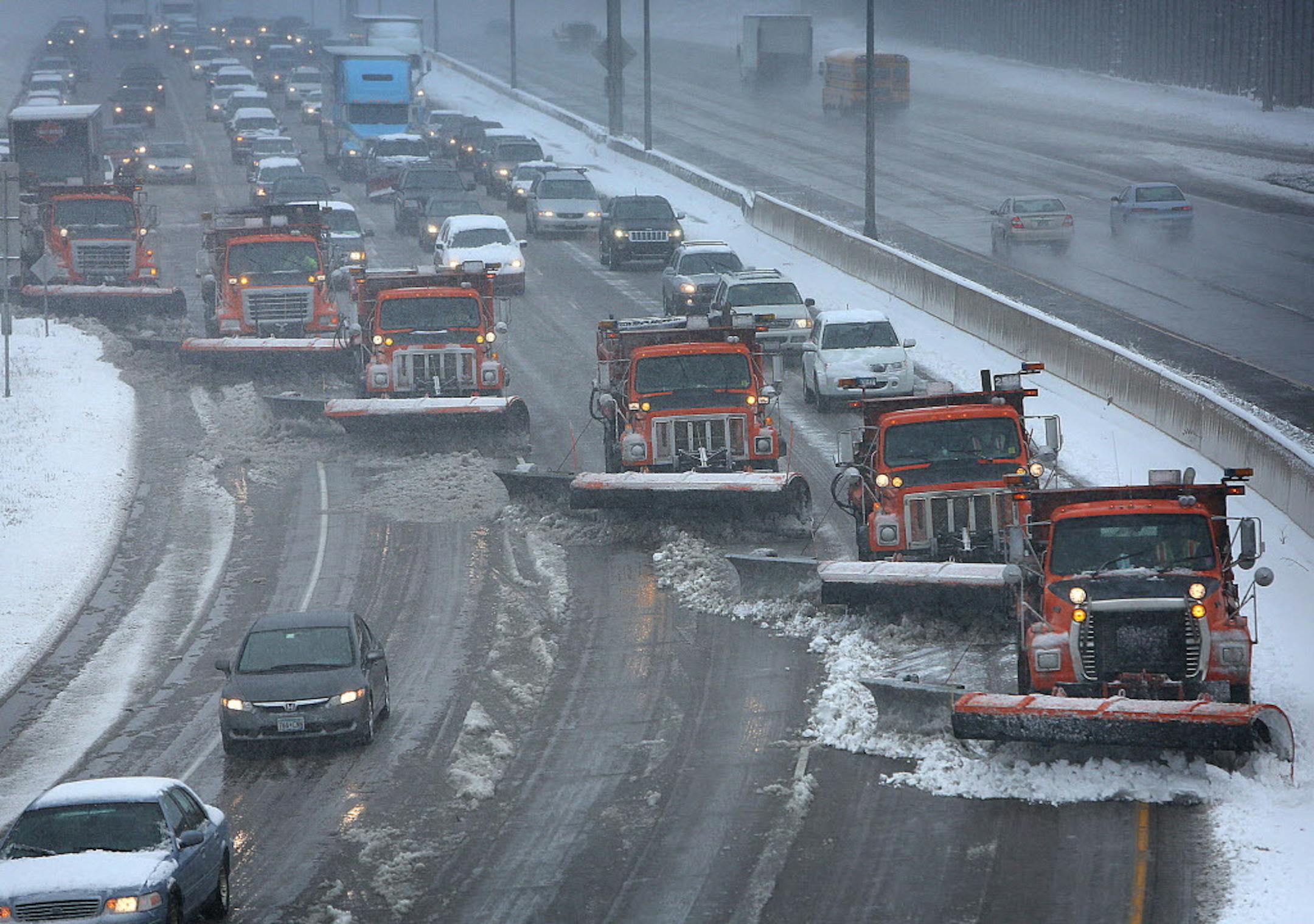 On April, 11, 2013, snow plows teamed up to clear the west bound lanes of Interstate 94 near Burns Ave. in St. Paul.