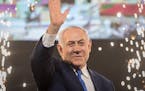 10 April 2019, Israel, Tel Aviv: Benjamin Netanyahu, Prime Minister of Israel, beckons supporters after the polling stations have been closed on April