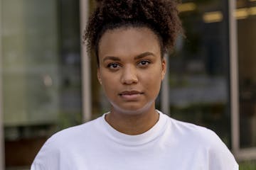 First year medical student, Emily Otiso, 25, stands for a portrait outside of Wayne State Medical School on August 9, 2020 in Detroit, Mich. Otiso fel