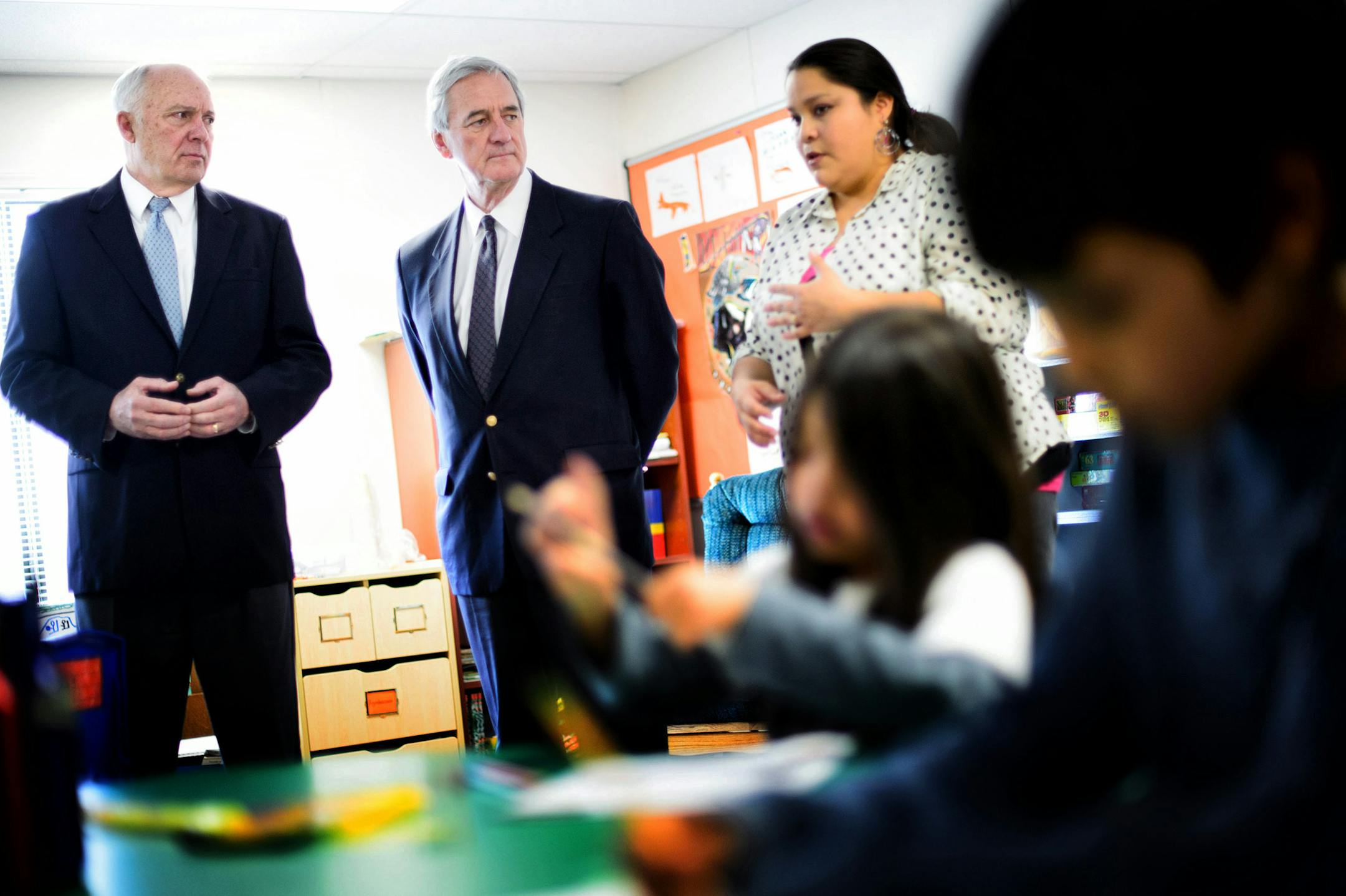 Rep. John Kline and Rep. Rick Nolan listened as first and second grade language teacher Jamie Copenace, right, described the importance of teaching students in the Ojibwe language and how difficult it is to teach in a temporary trailer classroom.