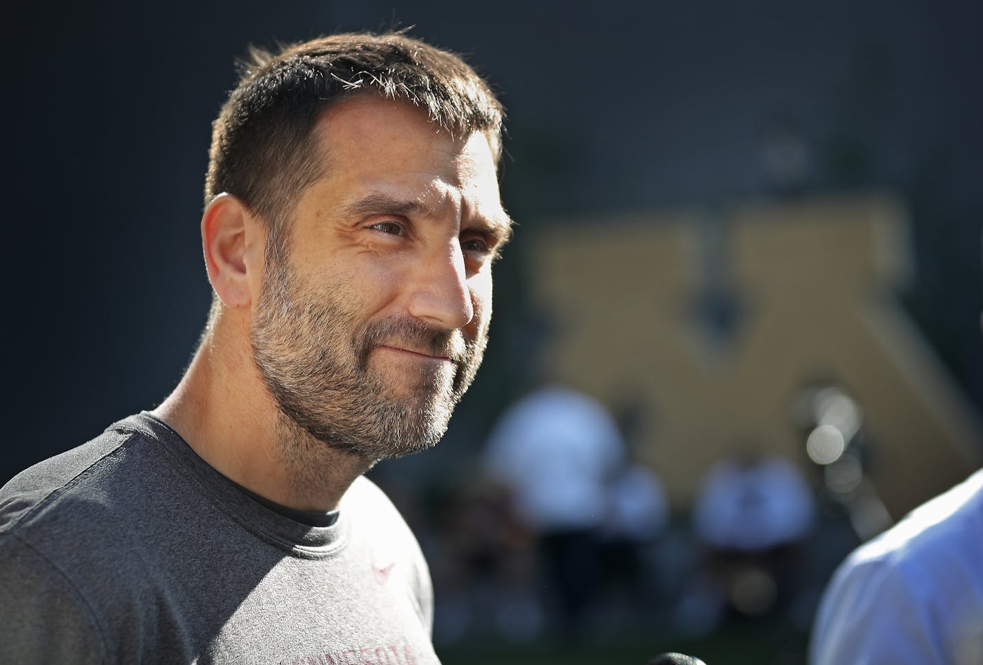 University of Minnesota defensive coordinator Joe Rossi being interviewed by media members following practice Wednesday, Oct. 9, 2019, in Minneapolis, MN.]