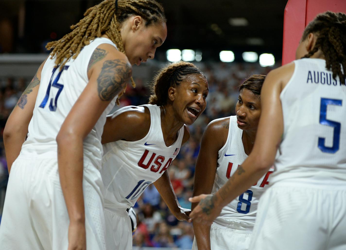 The United States' Tamika Catchings, second from left, huddled with teammates (from left) Brittney Griner, Angel McCoughtry and Seimone Augustus during the second half of an exhibition basketball game against Canada on Friday.