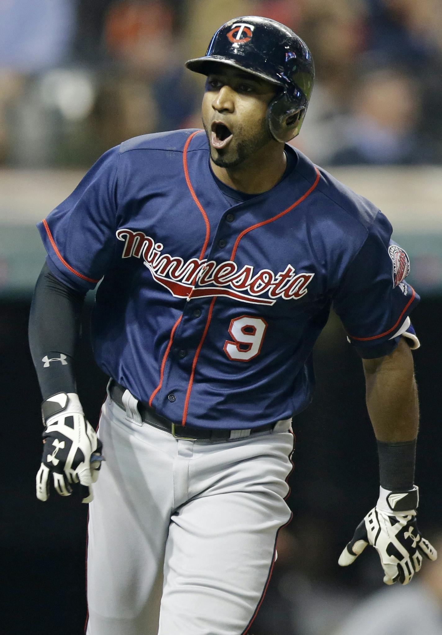 Minnesota Twins' Eduardo Nunez looks to the dugout after hitting a solo home run off Cleveland Indians relief pitcher Bryan Shaw during the eighth inning of a baseball game Friday, May 13, 2016, in Cleveland. (AP Photo/Tony Dejak)