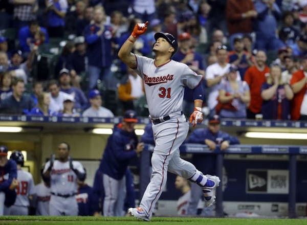 Oswaldo Arcia celebrates his two-run home run during the sixth inning of a baseball game against the Milwaukee Brewers. He also had several key defens
