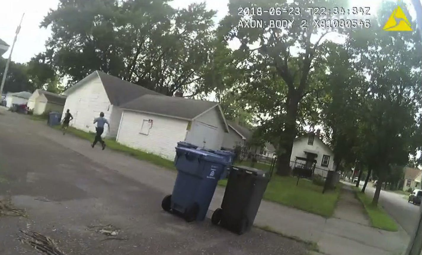 A still frame grab from the body cam worn by Officer Ryan Kelly showing Officer Justin Schmidt as he pursued Thurman Blevins in an alley on June 23, 2018.