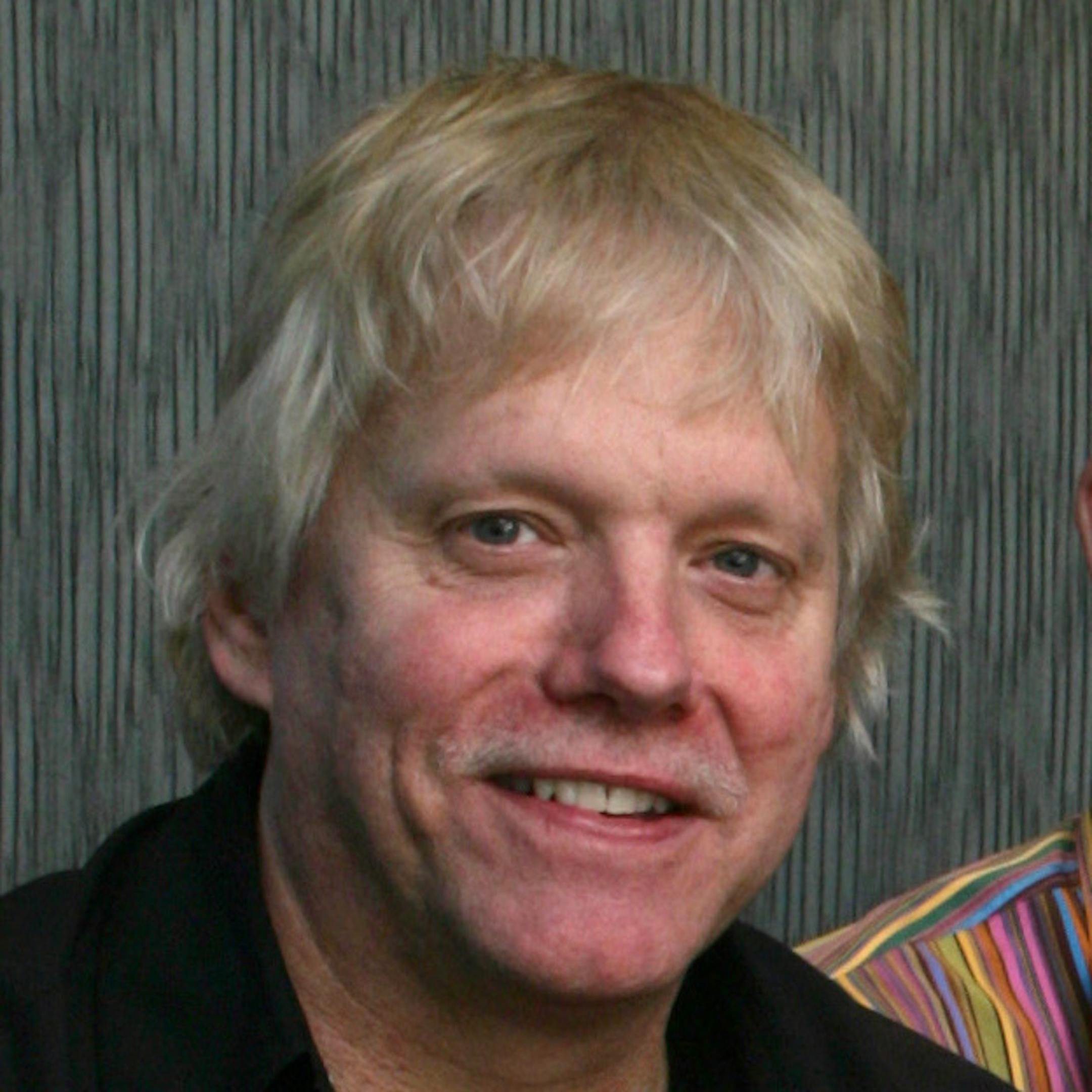 EDGEWATER0121 00006273a] R.D. Zimmerman, left, whose most recent historical novel (under pen name of Robert Alexander) is "The Romanov Bride," and architect Lars Peterssen in a seating cove built into a corner off the kitchen. Zimmerman writes at home, working on a desk desighned for him by Peterssen.