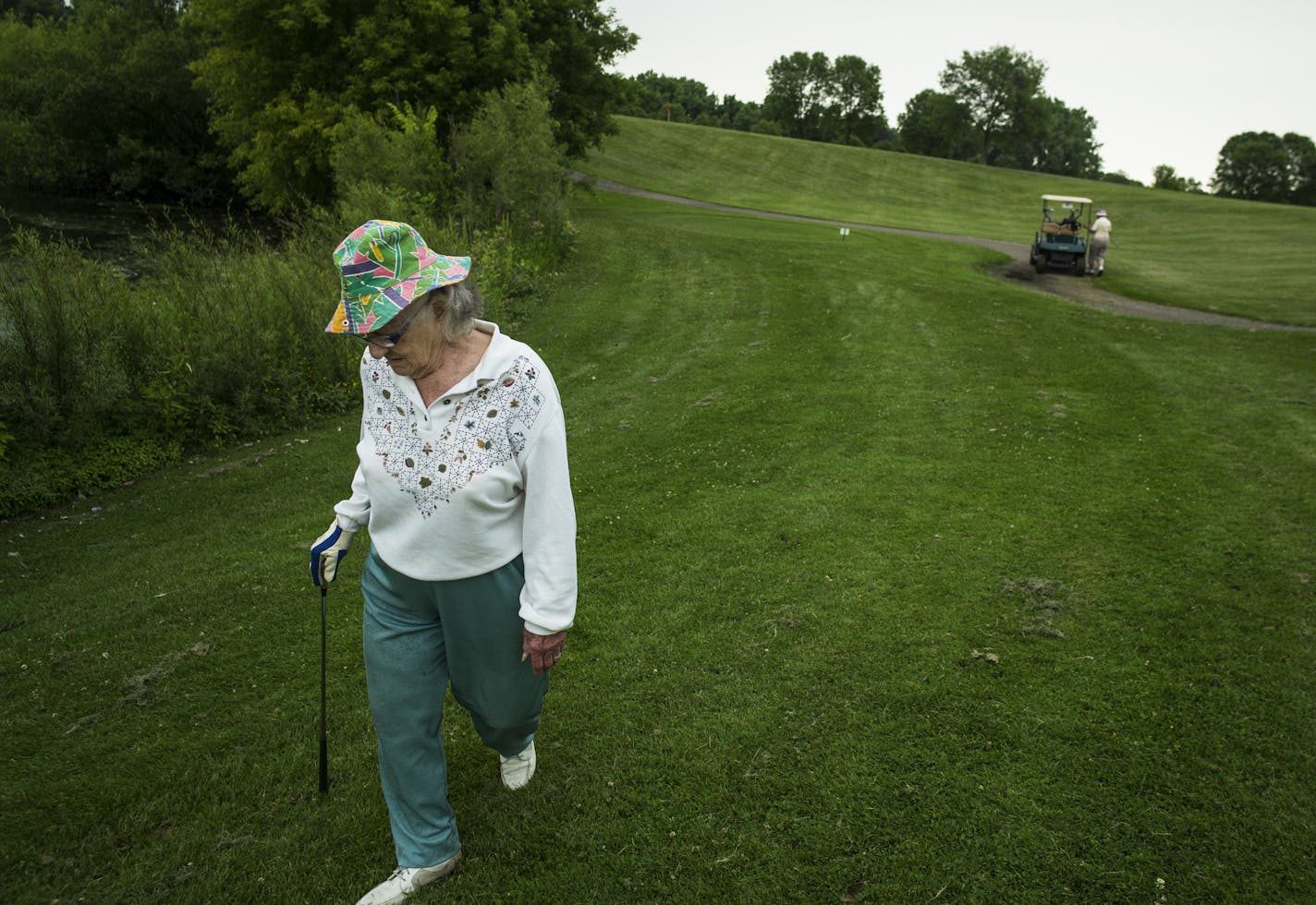 At the Thompson Oaks Golf Course in West St. Paul, Pat Tiller,90, walks toward the practice green to warm up. This site might be one of the few municipal golf courses that could be repurposed as a possible town center.] Richard Tsong-Taatarii/rtsong-taatarii@startribune.com