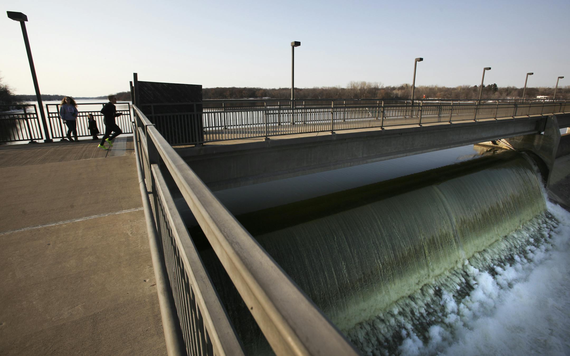 The Mississippi River flows over the Coon Rapids Dam on Thursday.