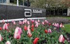 A sign at an Abbott Laboratories campus facility is seen in Lake Forest, Ill., on Thursday, April 28, 2016. Abbott Laboratories will buy St. Jude Medi