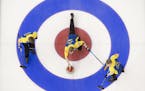 Sweden skip Niklas Edin makes a shot as lead, Christoffer Sundgren, left, and second, Rasmus Wrana look on during the 7th draw against Japan at the Me