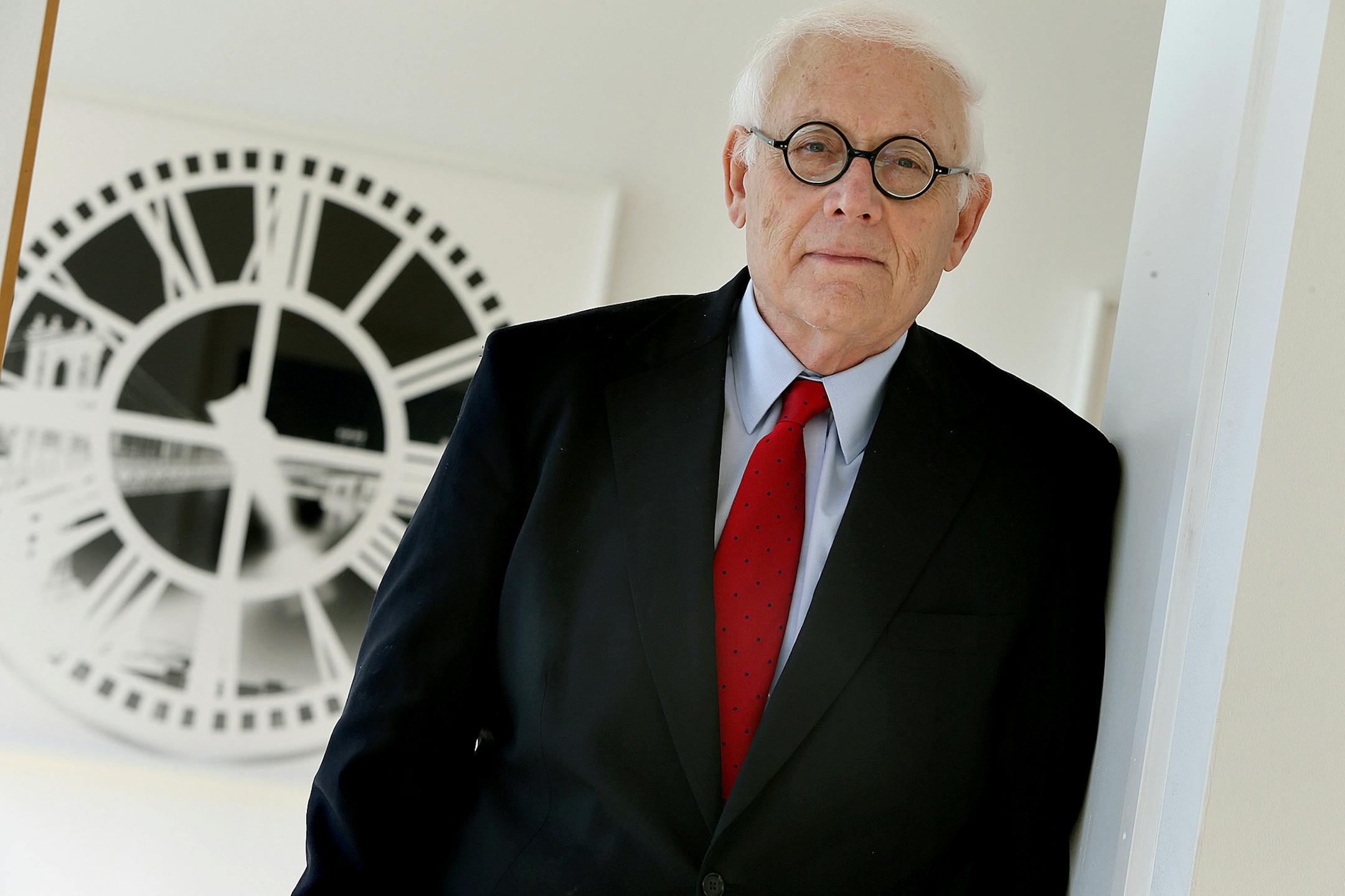 Gallery owner Martin Weinstein will be featured in the Minneapolis Institute of Arts show "31 Years: Gifts from Martin Weinstein." The show opens November 2, 2013. Here, Weinstein is photographed in front of a photo piece that shows the area where he was born in Brooklyn, NY.(ELIZABETH FLORES/STAR TRIBUNE) ELIZABETH FLORES • eflores@startribune.com