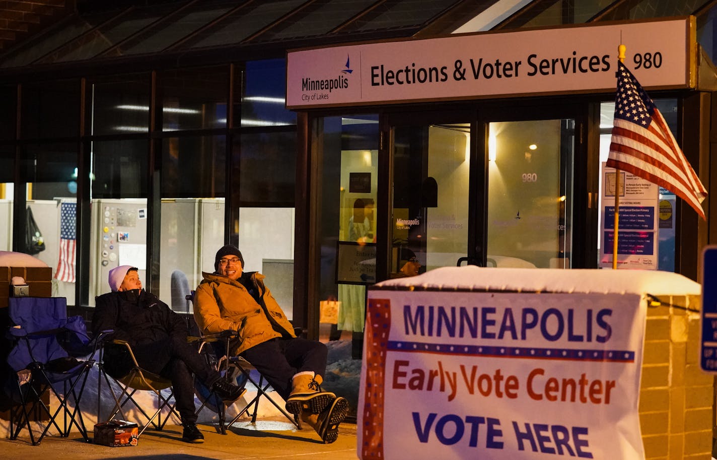 Davis Senseman and Jared Mollenkof arrived at the Minneapolis Early Voting Center Thursday night so they could be among the first voters in the 2020 election, when the center opens at 8:00 a.m. Friday. They plan to vote for Elizabeth Warren. ] GLEN STUBBE &#x2022; glen.stubbe@startribune.com Friday, January 17, 2020 The