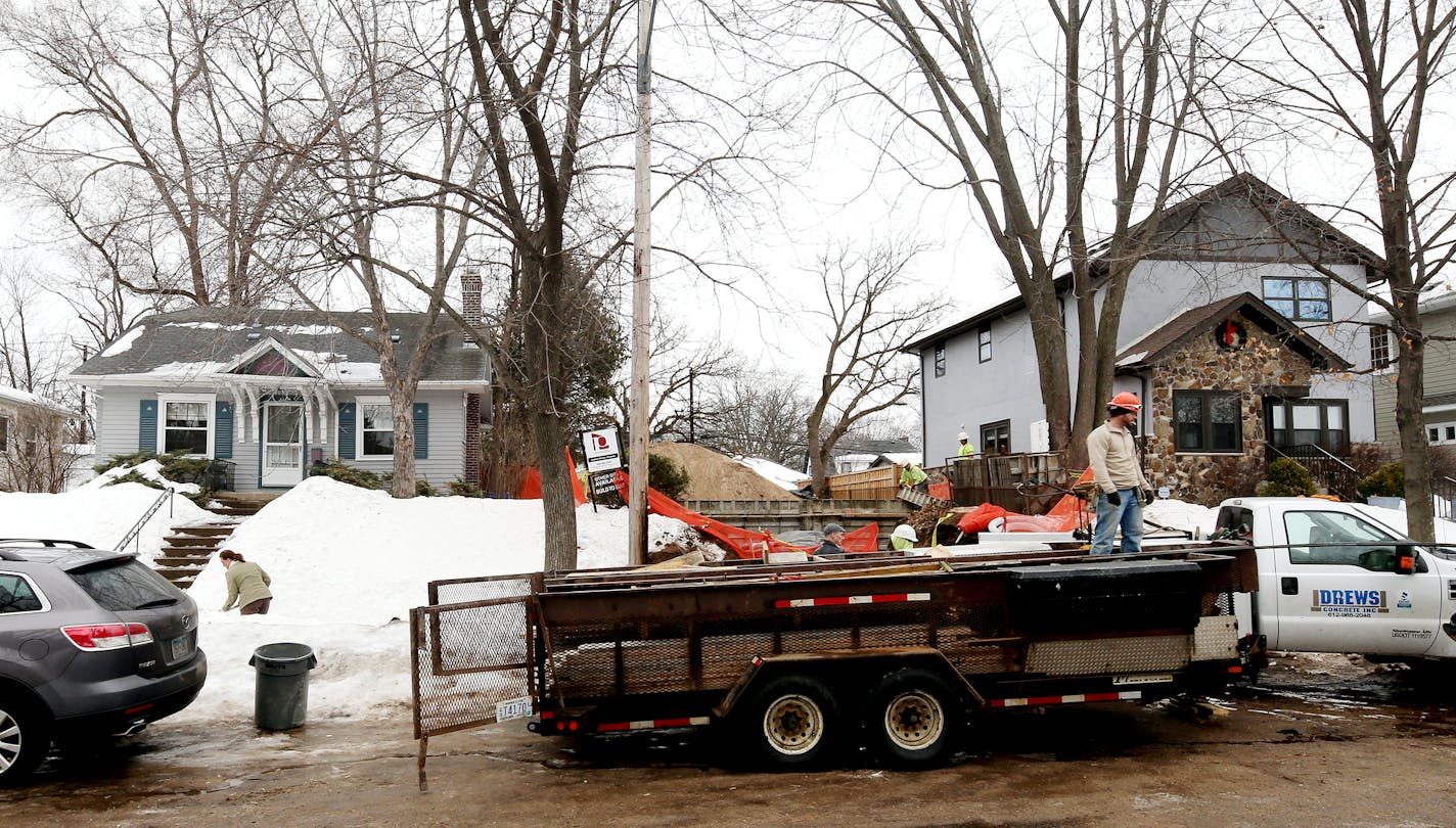 Sharon Potter (left) of Minneapolis shovels her walkway as construction has started on a teardown next to her home on the 5100 block of York. ] JOELKOYAMA&#x201a;&#xc4;&#xa2;jkoyama@startribune March 11, 2014 Six years after Minneapolis thought it had solved the teardown-and-build-new housing problem, it's back in a big way. Calling it the most urgent issue in her southwest ward, new city council member Linea Palmisano engineered an immediate moratorium on the demolition and construction of sing