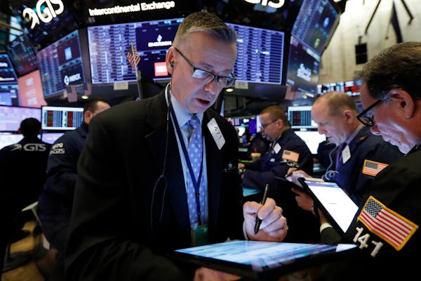 Trader Neil Catania works on the floor of the New York Stock Exchange on Friday when the markets ended with the worst week since 2008.